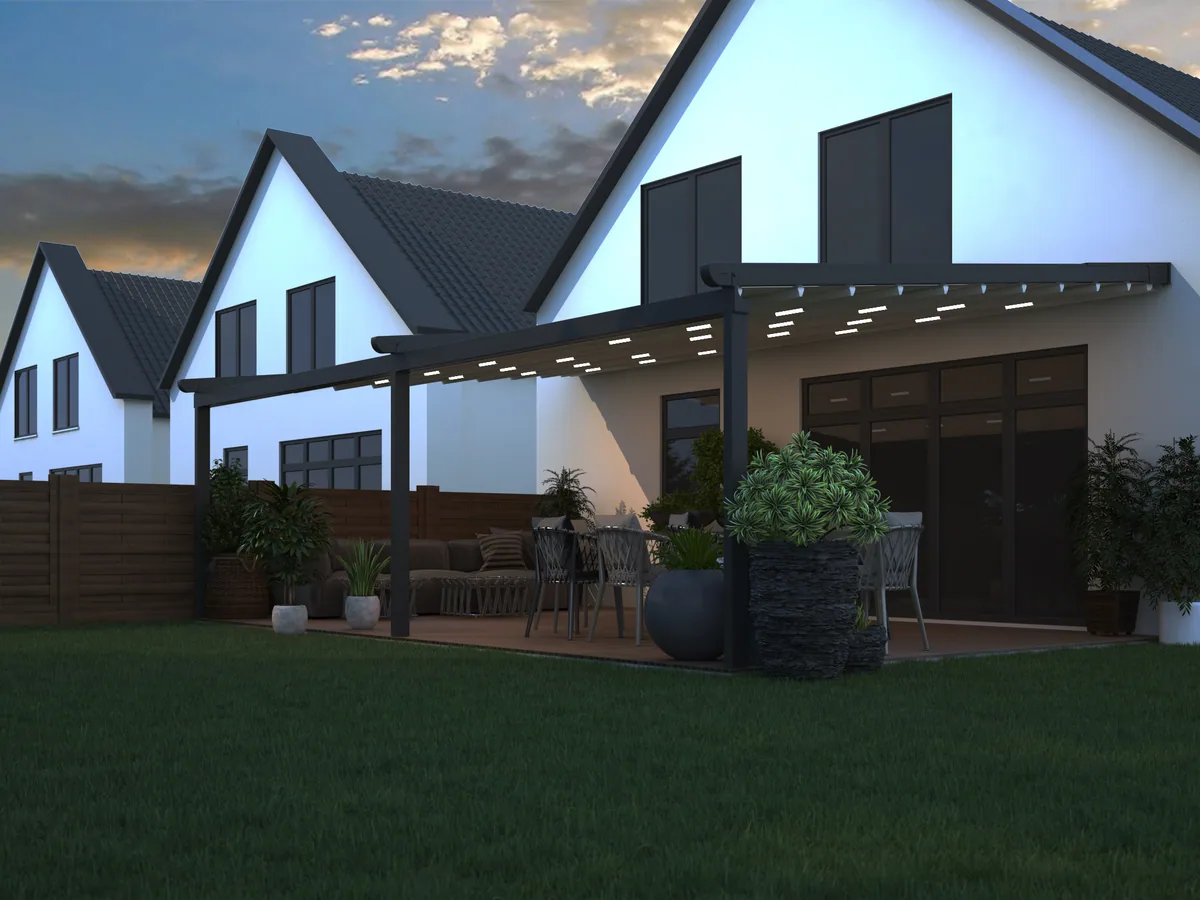 Verdeca pergola with folding roof lit at dusk