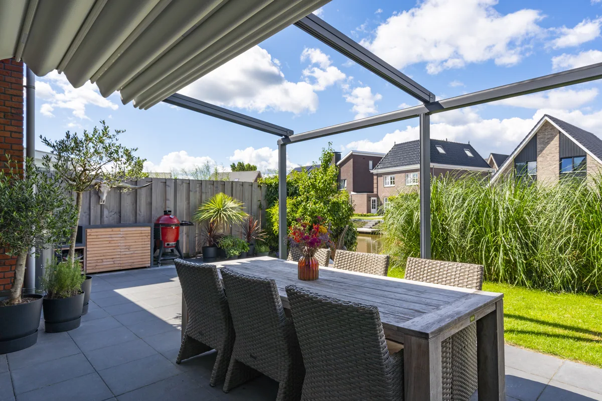 Verdeca pergola in a landscaped garden